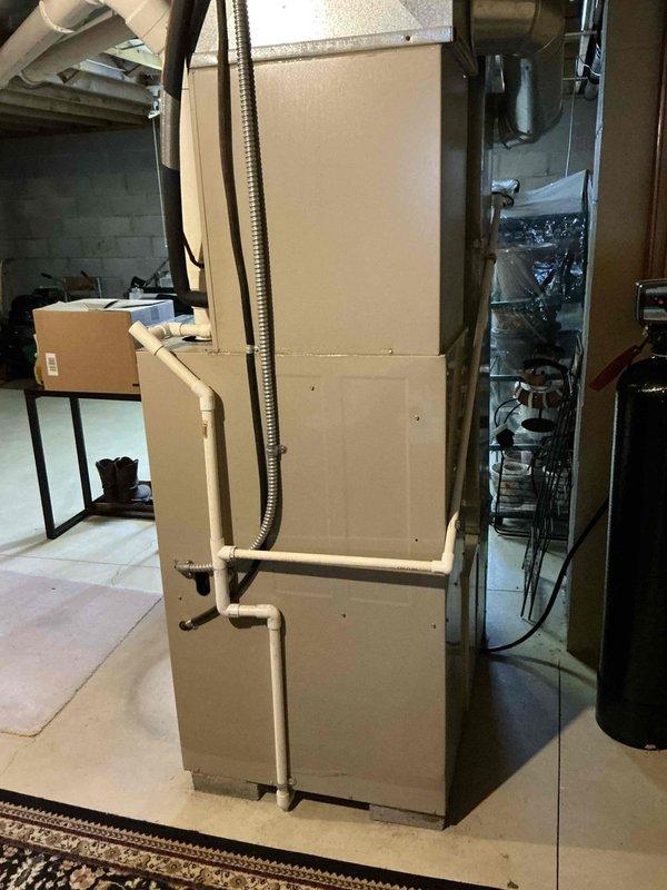 Provided comprehensive estimate for complete HVAC system replacement in residential basement installation. Existing gas furnace exceeded 25-year service life and required replacement due to age and efficiency concerns. Evaluated current equipment configuration including furnace unit, water heater placement, and existing ductwork connections. Assessed basement mechanical room layout, ceiling clearances with exposed joists, concrete floor conditions, and available space for new equipment installation. Documented existing system specifications, duct connections, and utility routing including gas lines, electrical service, and condensate drainage requirements for proper replacement planning and equipment sizing recommendations.