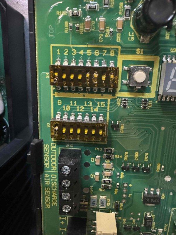 Completed comprehensive AC tune-up including inspection of control board components, DIP switch configurations, and outdoor discharge/air sensor connections. Verified proper electrical connections at contactor assembly, inspected all power and control wiring terminals, and confirmed grounding integrity throughout the system.