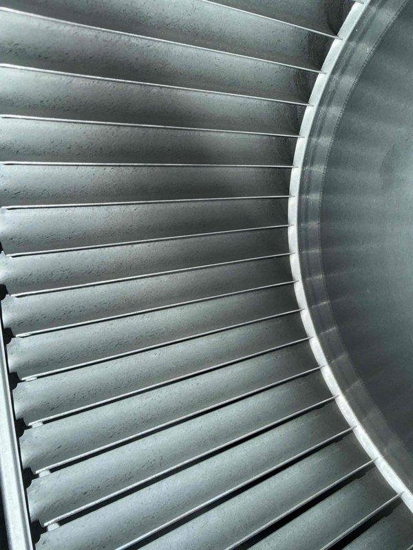 Completed MVP cooling visit and preventive maintenance inspection on Lennox air conditioning system. Inspected and photographed blower wheel assembly, confirming clean operation of squirrel cage fan with no debris accumulation. Examined outdoor condenser unit positioned on concrete pad, verified proper clearance and unit condition. Applied sealant to exterior component as previously discussed with customer to address weatherproofing concern.