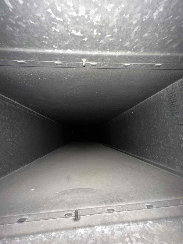 Completed comprehensive duct cleaning service for residential HVAC system with 14 vents. Removed significant accumulation of dust, lint, and particulate debris from ductwork and system components, including heavily contaminated access ports and main trunk lines. Documented pre-service conditions showing substantial buildup on interior surfaces and insulation areas, then thoroughly cleaned all accessible duct sections to restore proper airflow and indoor air quality.