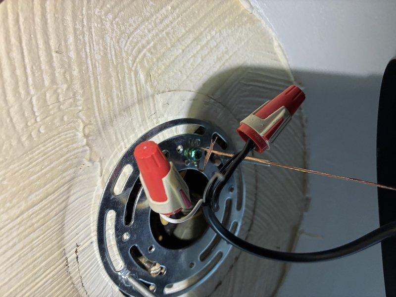 Removed existing pendant light fixture from ceiling and installed new ceiling fan with integrated light kit featuring three frosted glass shades. Completed all electrical connections, secured mounting bracket to ceiling junction box, and verified proper operation of fan and lighting functions.