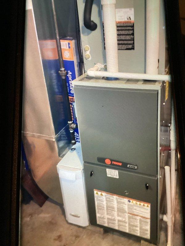 Completed comprehensive furnace inspection on approximately 9-10 year old Trane heating unit as part of customer's maintenance plan. Performed thorough system evaluation, inspected and cleaned flame sensor showing signs of oxidation and heat exposure, verified all components operating within manufacturer specifications, and documented equipment condition with photos for service records.
