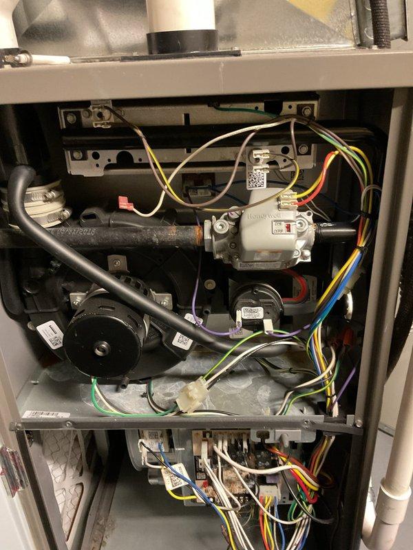 Responded to no heat call on 7-year-old residential gas furnace. Upon inspection, accessed unit cabinet and performed diagnostic evaluation of gas valve assembly, electrical connections, and burner compartment. Verified proper wiring connections to gas valve including control wires, inspected burner ports and combustion chamber area, and confirmed all mechanical components were functioning correctly. System restored to normal heating operation.