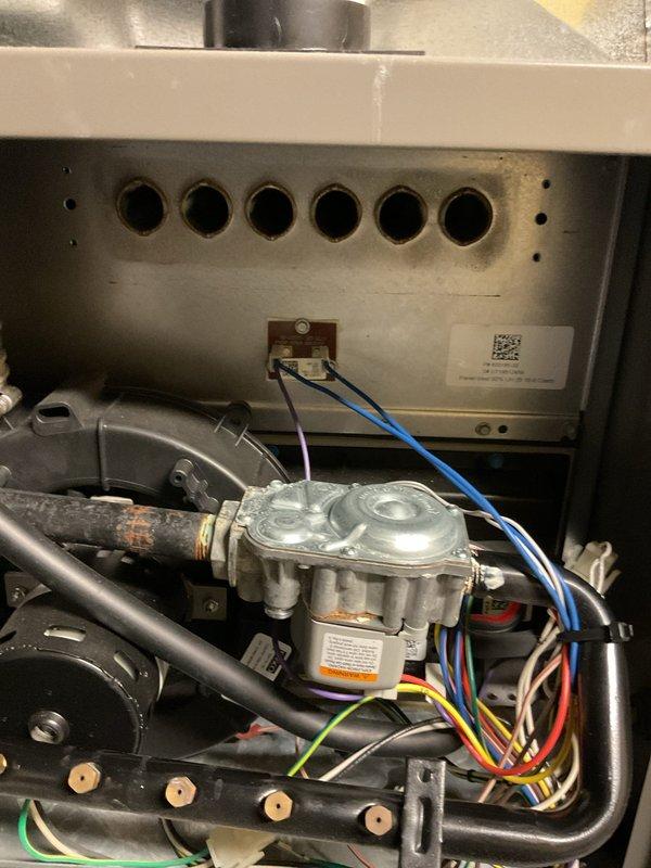 Responded to no heat call on 7-year-old residential gas furnace. Upon inspection, accessed unit cabinet and performed diagnostic evaluation of gas valve assembly, electrical connections, and burner compartment. Verified proper wiring connections to gas valve including control wires, inspected burner ports and combustion chamber area, and confirmed all mechanical components were functioning correctly. System restored to normal heating operation.