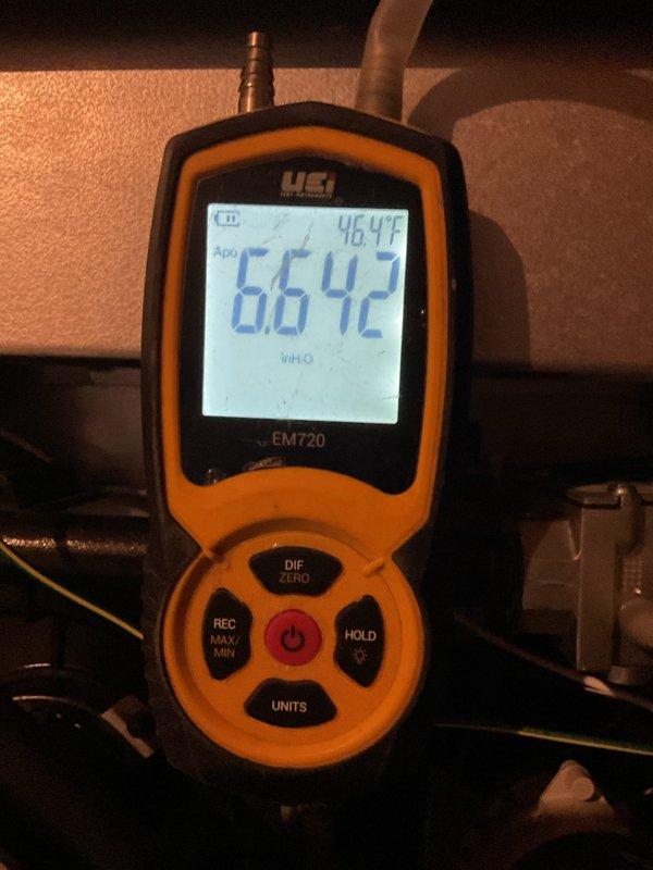 Completed routine MVP heating maintenance visit and system inspection. Examined mechanical infrastructure including refrigerant lines, condensate piping, and electrical conduit routing in ceiling space, verifying proper insulation and support. Performed diagnostic measurements using digital meter, recording supply air temperature of 66.42°F and verifying system operation within normal parameters. All components inspected and found operating satisfactorily with no immediate service needs identified.