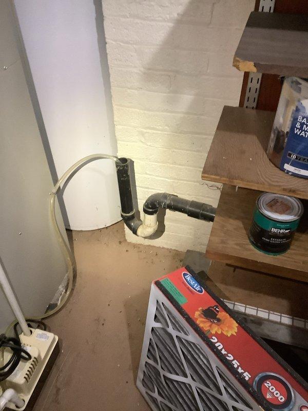 # Main Drain Cleanout

Responded to a main drain backup issue in a 70-year-old residential property where wastewater was overflowing onto the basement floor. Upon arrival, assessed the basement utility area and located the floor drain exhibiting active backup with visible water staining and discoloration on the surrounding concrete surface.

Deployed professional drain cleaning equipment, including a power auger with flexible cable, to access and clear the main sewer line. Worked systematically through the floor drain access point to break up and remove the obstruction causing the slow drainage and backup condition. The blockage was consistent with typical accumulations found in aging residential plumbing systems, including years of buildup from grease, soap residue, and organic debris.

Successfully cleared the main drain line and restored proper flow. Conducted water flow testing to verify complete clearance and confirm the drain was functioning at optimal capacity. Inspected the flo