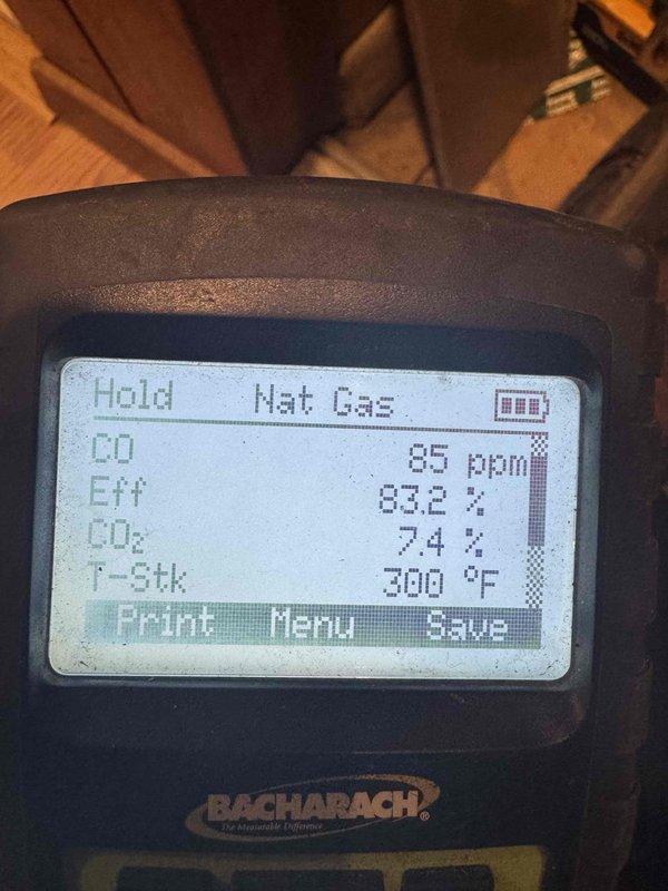 Completed comprehensive tune-up service on two furnace units, both approximately 15 years old. Performed combustion analysis on natural gas furnace showing 65 ppm CO, 83.2% efficiency, 7.4% CO₂, and 300°F stack temperature, all within acceptable operating parameters. Documented existing corrosion on ductwork and ventilation components for maintenance records.