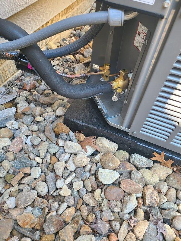 Removed existing zone control system from 80% AFUE air conditioning unit and reconfigured to single thermostat operation. Disconnected zone control panel, dampers, and associated wiring from the system. Installed new direct thermostat wiring to provide single-zone control of the complete HVAC system. Replaced dual-element time delay fuses at the disconnect to ensure proper electrical protection for the reconfigured system. Verified all refrigerant line connections at the outdoor condensing unit remain secure with proper insulation. Tested system operation under new single thermostat configuration and confirmed proper cooling cycle functionality.