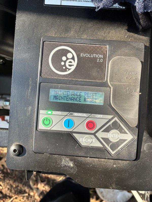 Completed annual preventive maintenance on whole house Evolution 2.0 standby generator system. Performed comprehensive inspection of unit including control panel functionality, ventilation louvers, and exterior housing condition. Reset maintenance indicator on digital display panel and verified proper operation of AUTO/MANUAL/OFF control functions with illuminated button indicators. Generator found in excellent working condition with no operational issues or deficiencies noted during testing and inspection.