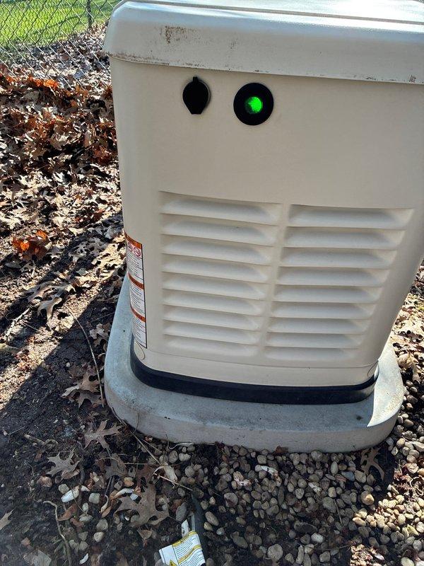 Completed annual preventive maintenance on whole house Evolution 2.0 standby generator system. Performed comprehensive inspection of unit including control panel functionality, ventilation louvers, and exterior housing condition. Reset maintenance indicator on digital display panel and verified proper operation of AUTO/MANUAL/OFF control functions with illuminated button indicators. Generator found in excellent working condition with no operational issues or deficiencies noted during testing and inspection.