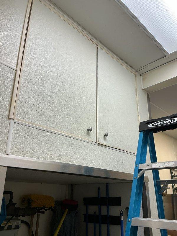 Provided quote for tanked water heater replacement in garage storage area. Assessed existing water heater installation including supply piping, connections, and access requirements. Documented current equipment configuration and surrounding workspace for replacement planning.