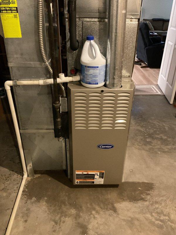 Completed preventive maintenance tune-up on 21-year-old Carrier air conditioning system. Performed comprehensive inspection of indoor furnace unit, electrical components including contactor and capacitor, verified all electrical connections secure, and assessed overall system operation. All components found to be in functional condition with normal wear consistent with equipment age.