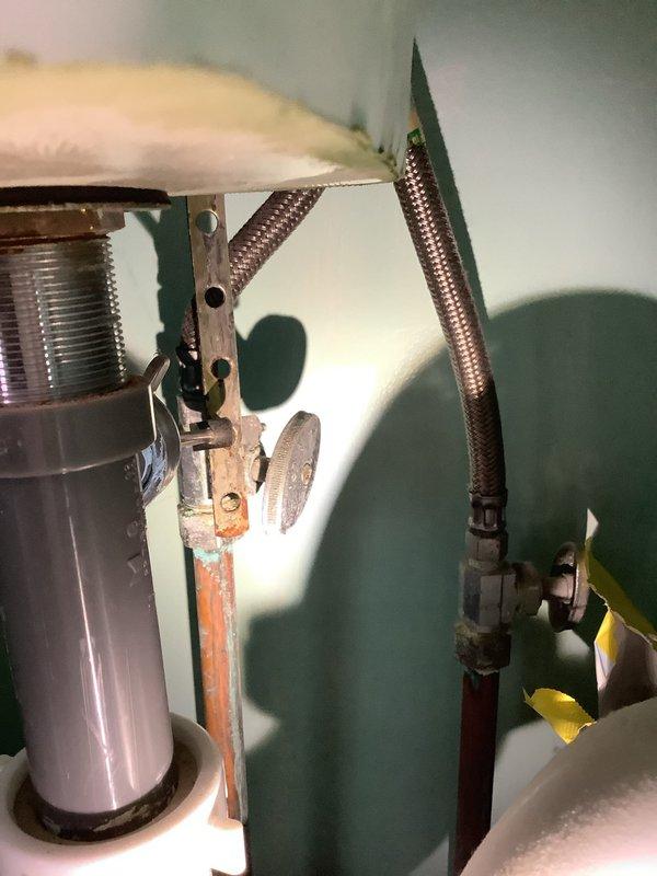 Responded to service call for running toilet and dripping faucet in two separate bathrooms. Inspected toilet fill valve assembly and flapper mechanism to diagnose continuous running issue. Examined faucet cartridge and supply line connections at vanity sink with turquoise marbled countertop to identify source of drip. Evaluated water supply plumbing including flex lines, shut-off valves, and copper piping. Provided customer with repair recommendations and options for both fixtures to restore proper operation and eliminate water waste.