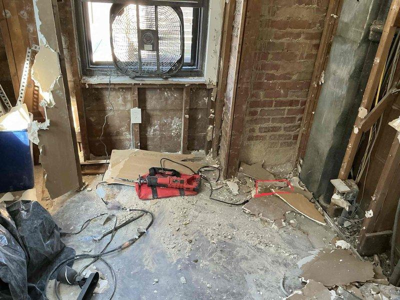 Conducted site assessment for ductwork addition and rerouting in residential space undergoing renovation. Evaluated existing structure with exposed framing and marked ceiling locations for new fan installation and duct routing. Documented current conditions of work area to develop comprehensive ductwork modification plan.