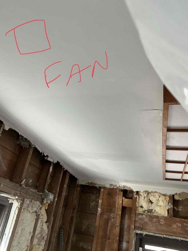Conducted site assessment for ductwork addition and rerouting in residential space undergoing renovation. Evaluated existing structure with exposed framing and marked ceiling locations for new fan installation and duct routing. Documented current conditions of work area to develop comprehensive ductwork modification plan.