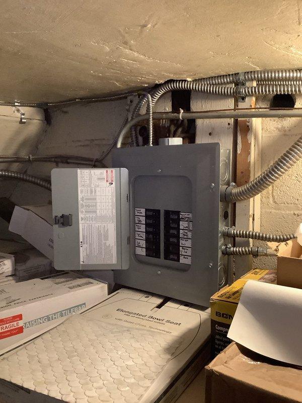 Installed Ring camera light combination unit at exterior location. Assessed bathroom electrical system to verify adequate circuit capacity and proper outlet configuration for customer's desired heater installation. Inspected electrical panel to confirm available breaker capacity and reviewed existing circuit loads to ensure safe operation of additional heating appliance.