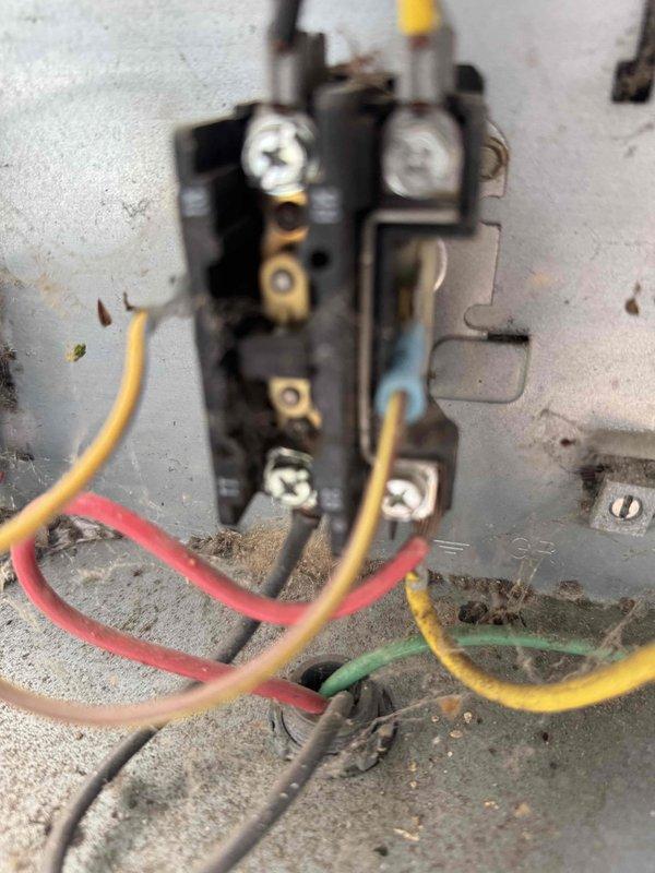 Completed comprehensive AC tune-up service including inspection of electrical components and blower assembly. System showed significant dust and debris accumulation on blower wheel and internal surfaces, with contactor and wiring connections exhibiting normal wear patterns consistent with extended operation period.