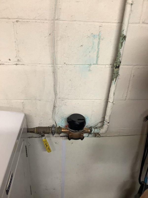 Provided estimate for replacement of 20-year-old Richmond Integra water heater with 6-year warranty that was leaking from the bottom. The existing unit had previously had its expansion tank removed by the city due to code violations related to its placement near an exterior wall, and subsequently developed a tank leak requiring full replacement.