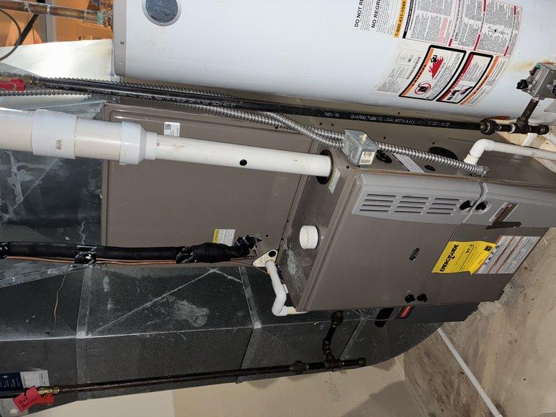 Completed comprehensive AC tune-up on residential HVAC system with furnace and air conditioning components. Performed standard maintenance inspection including examination of control board, electrical connections, and wiring harness—all components found to be in serviceable condition with proper connections intact. Unit operational and ready for cooling season.