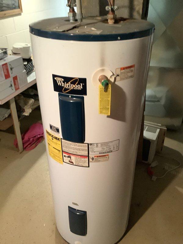 Conducted no-charge estimate visit for tankless water heater installation at owner-occupied residence approximately 66 years old. Assessed existing Whirlpool conventional tank water heater currently installed in basement utility area, documenting unit condition, existing plumbing connections including copper supply lines, electrical service availability, and venting configuration. Evaluated structural requirements, gas line capacity considerations, and necessary modifications for tankless conversion including upgraded electrical service, proper venting pathway, and water supply line adjustments. Photographed current water heater installation and surrounding mechanical space to determine optimal placement and identify potential installation challenges specific to older home construction.