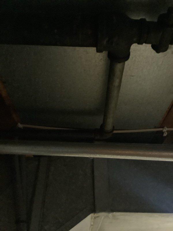 Conducted no-charge estimate visit for tankless water heater installation at owner-occupied residence approximately 66 years old. Assessed existing Whirlpool conventional tank water heater currently installed in basement utility area, documenting unit condition, existing plumbing connections including copper supply lines, electrical service availability, and venting configuration. Evaluated structural requirements, gas line capacity considerations, and necessary modifications for tankless conversion including upgraded electrical service, proper venting pathway, and water supply line adjustments. Photographed current water heater installation and surrounding mechanical space to determine optimal placement and identify potential installation challenges specific to older home construction.