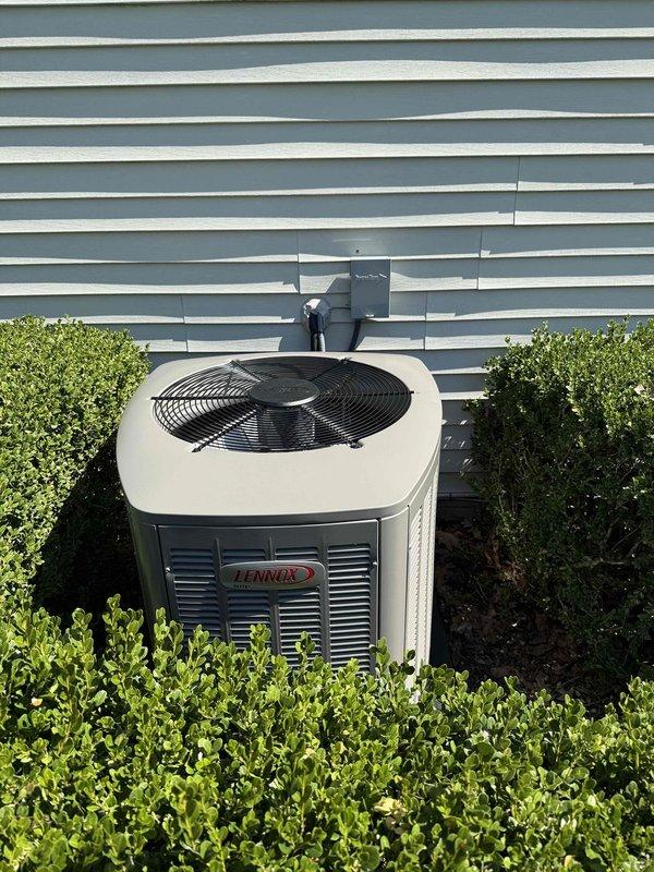 Completed full HVAC system installation including an 80,000 BTU downflow air conditioning unit. Installed Lennox brand outdoor condenser unit against building exterior with proper clearances maintained from surrounding landscaping. Ran electrical conduit along exterior wall to power supply connection. Installed carbon monoxide alarm in utility area near water heater for safety compliance. Verified all system components operational and tested alarm functionality upon completion.