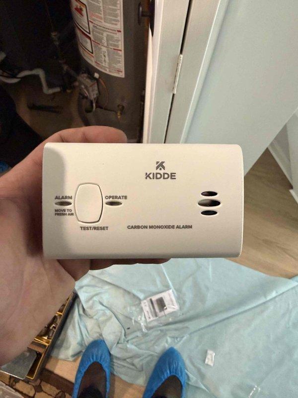 Completed full HVAC system installation including an 80,000 BTU downflow air conditioning unit. Installed Lennox brand outdoor condenser unit against building exterior with proper clearances maintained from surrounding landscaping. Ran electrical conduit along exterior wall to power supply connection. Installed carbon monoxide alarm in utility area near water heater for safety compliance. Verified all system components operational and tested alarm functionality upon completion.