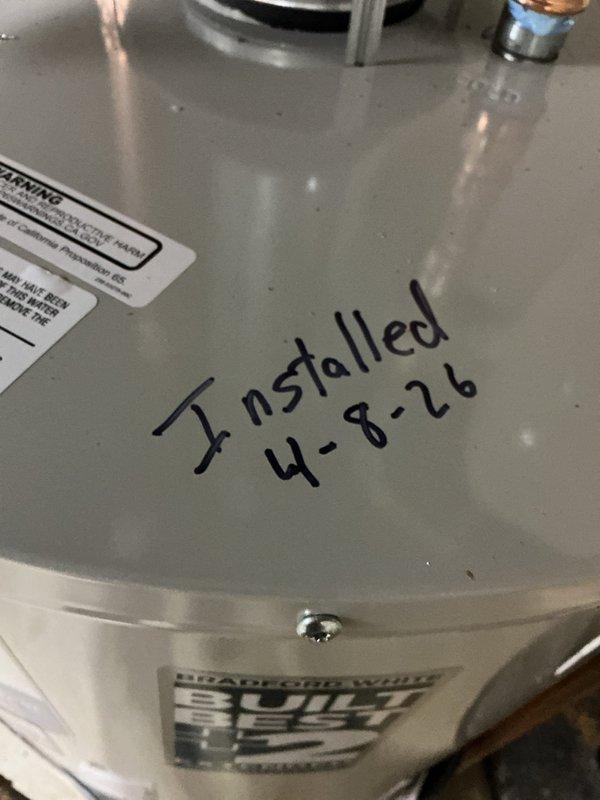 Removed existing residential water heater and installed new Bradford White replacement unit in basement utility area. Replaced thermal expansion tank during installation and verified all existing components meet current code requirements. Connected copper supply lines with brass fittings and valves, installed proper venting system, and confirmed all plumbing connections are secure and operational. Unit includes 8-year manufacturer warranty and all safety labels properly affixed.
