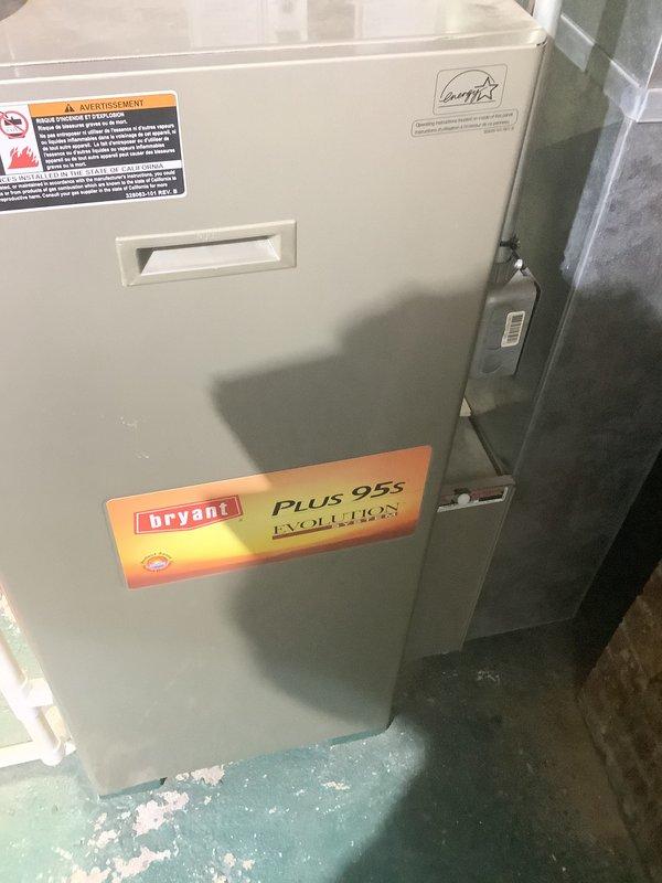 Completed furnace replacement estimate for an 18-year-old Bryant Plus 96S Evolution gas furnace that is currently operational. Inspected existing equipment in mechanical room, documented unit specifications and condition, and photographed furnace and associated ductwork installation. Assessed accessibility of equipment location and existing infrastructure to provide accurate replacement options for the homeowner-occupied residence.