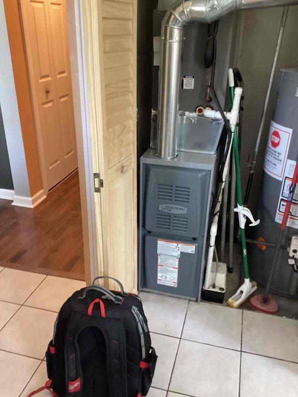 Completed routine preventive maintenance cooling visit on residential HVAC system. Accessed property using provided entry code, performed comprehensive inspection of furnace and cooling components including blower motor assembly, electrical connections, and internal wiring systems. Documented equipment condition through photographic records showing all major components, connections, and manufacturer specification labels for service history records.