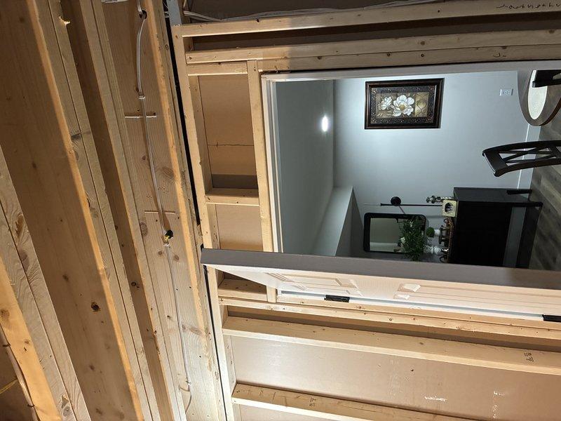Installed dedicated electrical circuit for tankless water heater in unfinished basement area. Ran new wiring through exposed framing from main electrical panel to equipment location, ensuring proper wire gauge and circuit protection for tankless unit specifications. Secured all conductors to structural members per code requirements and verified circuit functionality upon completion.