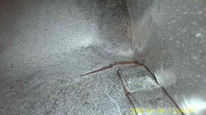 Completed preventive maintenance on 16-year-old air conditioning system. Discovered and replaced failed dual-run capacitor (45+5µF) which had ruptured and expelled internal insulation material. Cleared condensation drain line as requested to restore proper drainage and prevent water backup.