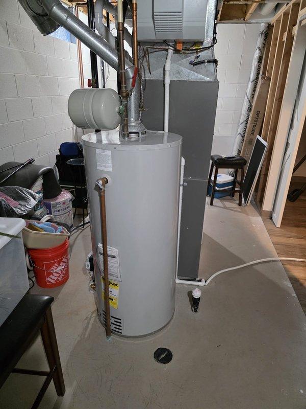 # HVAC Maintenance - Cooling

Completed routine MVP cooling maintenance visit in basement utility area. Performed standard inspection and maintenance procedures on HVAC cooling system located adjacent to water heater. System accessible through basement utility room with concrete block walls and unfinished ceiling joists. All cooling components inspected, tested, and verified operational per manufacturer specifications and seasonal maintenance protocols.