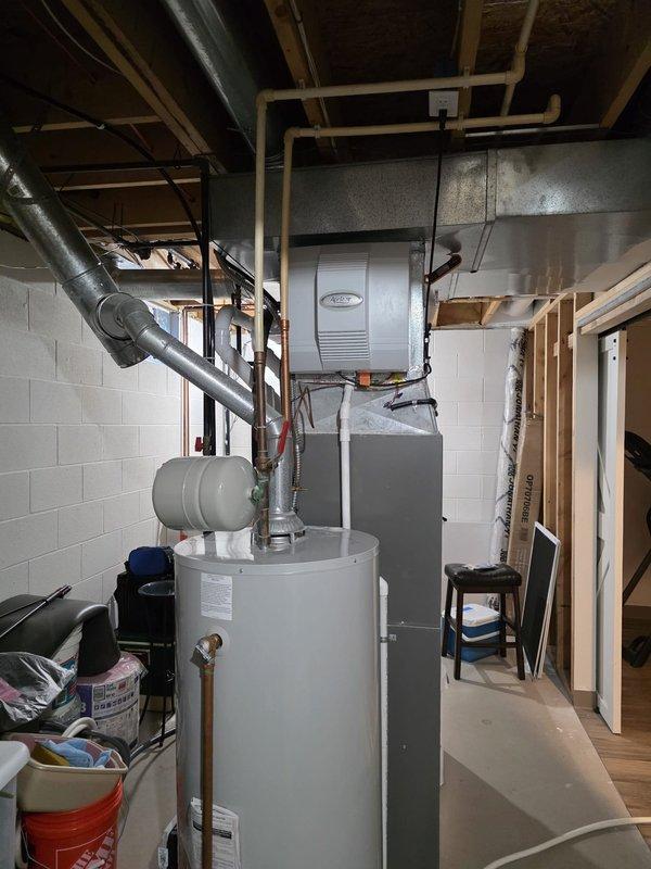 # HVAC Maintenance - Cooling

Completed routine MVP cooling maintenance visit in basement utility area. Performed standard inspection and maintenance procedures on HVAC cooling system located adjacent to water heater. System accessible through basement utility room with concrete block walls and unfinished ceiling joists. All cooling components inspected, tested, and verified operational per manufacturer specifications and seasonal maintenance protocols.