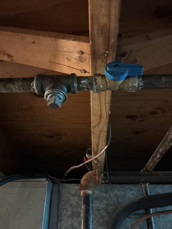 Responded to service call to repair two leaks in water supply lines servicing a fireplace. Located and accessed the affected piping in the attic/ceiling space where galvanized and copper supply lines run through the wooden framing. Successfully repaired both leaks using truck stock materials, securing pipes with appropriate clamps and brackets to the structural framing members. Tested the system to confirm all leaks were eliminated and proper water flow was restored to the fireplace supply lines.