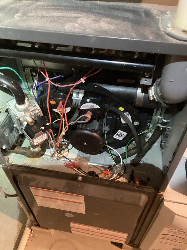 Completed routine air conditioning maintenance and system inspection. Performed visual examination of evaporator coil assembly, refrigerant lines, compressor unit, and electrical connections. All components found in satisfactory operating condition with proper wiring configuration and secure mounting hardware intact.