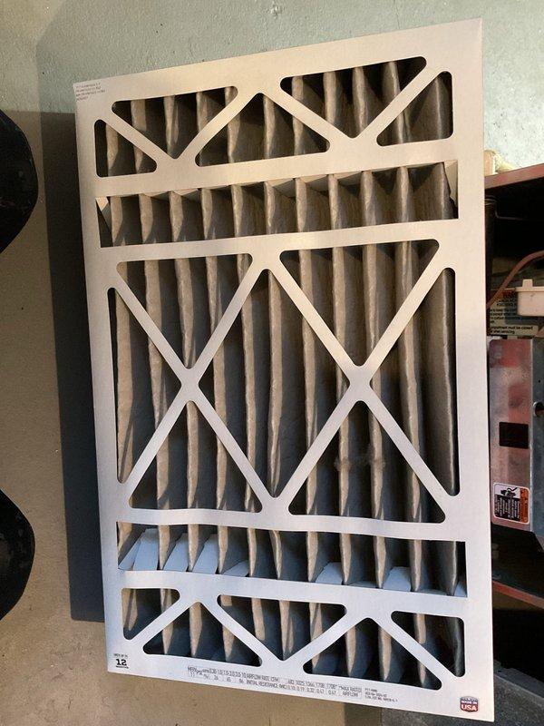 Completed routine air conditioner maintenance checkup for residential HVAC system. Performed comprehensive inspection of cooling equipment, verified proper operation of all components, and examined humidifier unit mounted on main ductwork with evaporator pad showing normal condition. Inspected and evaluated air filter condition, confirming adequate filtration media for continued system efficiency.