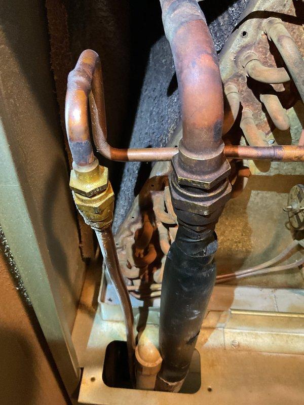 Completed comprehensive tune-up on 16-year-old air conditioning system. Inspected condenser unit fan assembly, verified proper operation of fan motor and blades, and examined refrigerant line connections showing age-appropriate patina but maintaining integrity. All components functioning within normal parameters for unit age.