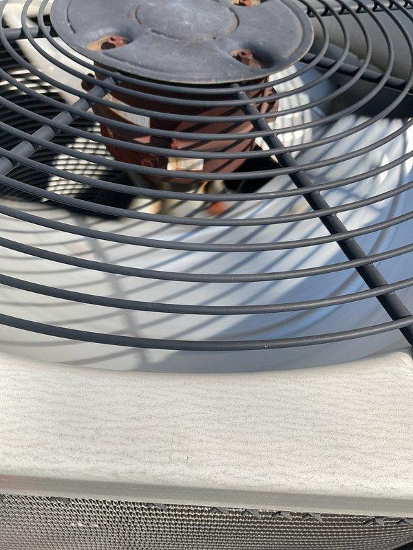 Completed comprehensive tune-up on 16-year-old air conditioning system. Inspected condenser unit fan assembly, verified proper operation of fan motor and blades, and examined refrigerant line connections showing age-appropriate patina but maintaining integrity. All components functioning within normal parameters for unit age.