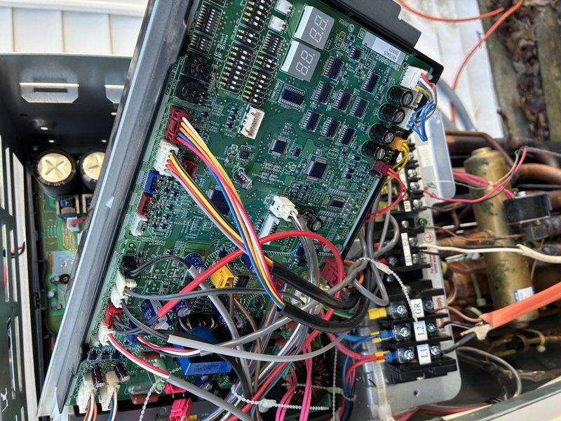 Replaced defective control boards in HVAC system. Initial service required ordering and installing primary circuit board, followed by a second appointment to install an additional board after determining the correct replacement part was needed. Both green PCB assemblies with integrated circuits, capacitors, and digital display components were successfully installed and system restored to proper operation.