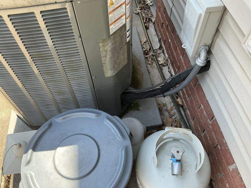 Conducted on-site evaluation and provided replacement estimate for existing 12-year-old residential HVAC system including both furnace and air conditioning components. Documented current equipment configuration showing outdoor condenser unit, air handler, and associated electrical connections and refrigerant lines for comprehensive system replacement proposal.