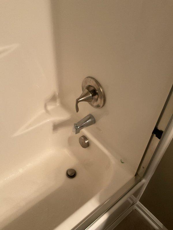 Responded to low water pressure complaint in upstairs bathroom tub faucet. Upon inspection, identified loose spigot and reduced flow at the tub faucet while shower function remained unaffected. Tightened mounting hardware on the brushed nickel wall-mounted faucet assembly and inspected aerator for debris or sediment buildup. Verified proper water pressure restoration to the tub spout and ensured secure fixture mounting to eliminate movement. System tested and confirmed operational.