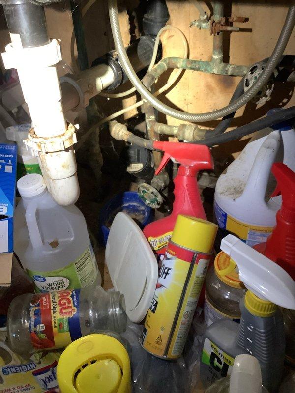 Responded to clogged kitchen sink drain in 1952-built residence. Upon arrival, assessed drainage system and determined blockage extended beyond fixture trap into main drain line. Accessed roof vent to perform cable augering of main line, successfully clearing obstruction and restoring full drainage capacity. Verified proper water flow through kitchen sink and inspected under-sink plumbing connections for leaks or additional issues. All fixtures tested and confirmed operational upon completion.