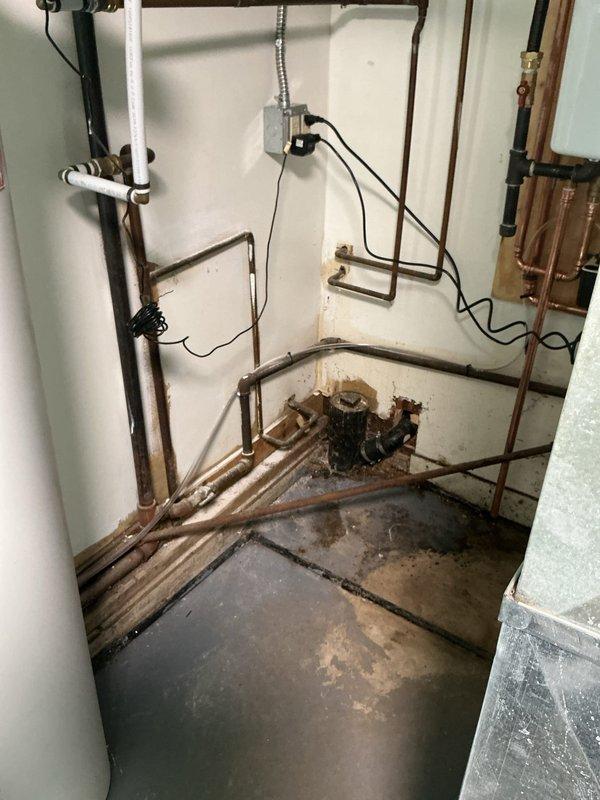 Completed installation of wall-mounted tankless water heater system in basement utility room. Removed existing water heating equipment and installed new Energy Star certified tankless unit on plywood backing board mounted to concrete block wall. Configured comprehensive copper piping network including supply and return lines with appropriate shut-off valves, pressure relief connections, and gas line integration. Installed condensate pump for drainage management and connected venting ductwork through galvanized steel exhaust system. Routed electrical supply with proper conduit and established digital control panel programming. All connections pressure tested and system commissioned to manufacturer specifications.