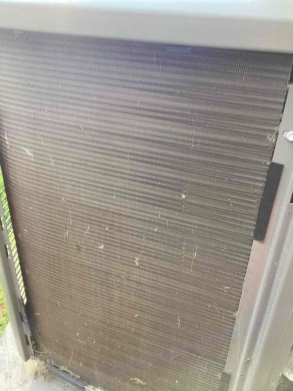 Completed early morning air conditioning tune-up service on residential split system. Performed comprehensive inspection of outdoor condenser unit, noting light debris accumulation on coil fins which was cleaned during service. Inspected indoor air handler and associated refrigerant lines, condensate drainage system, and ductwork connections in mechanical room. All components found operating within normal parameters with no immediate concerns identified.