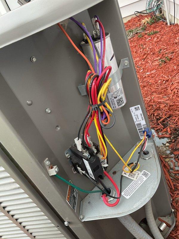 Completed comprehensive MVP AC maintenance on residential cooling system. Performed thorough inspection of indoor air handler unit and outdoor condensing unit, including examination of electrical connections, contactor operation, and refrigerant line insulation. Verified all wiring connections were secure with proper color coding, checked control panel components for proper operation, and documented system condition through detailed photography of both indoor and outdoor equipment.