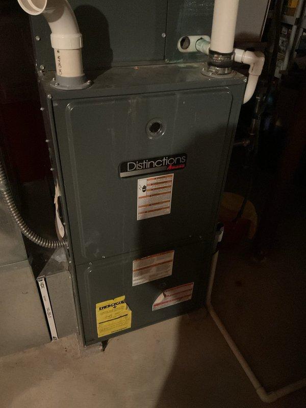 Completed scheduled MVP heating maintenance visit on Distinctions brand furnace system. Performed comprehensive inspection of unit, including examination of heat exchanger, blower assembly, and venting components. Documented existing rust and corrosion present on interior metal frame near blower housing. All PVC intake and exhaust venting connections verified secure. System operational at time of service completion.