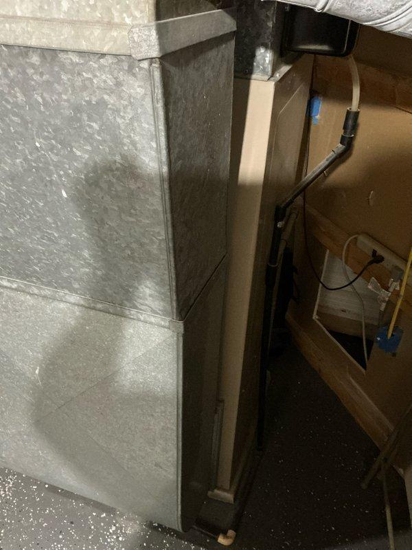 Completed comprehensive estimate for dual HVAC system replacement including two furnaces and two air conditioning units. Assessed existing equipment in mechanical room showing standard ductwork configuration with air handler, and evaluated two outdoor condenser units with the left unit displaying significant rust corrosion and deterioration on top cover and fan assembly. Provided pricing options including promotional offer for AC equipment replacement.