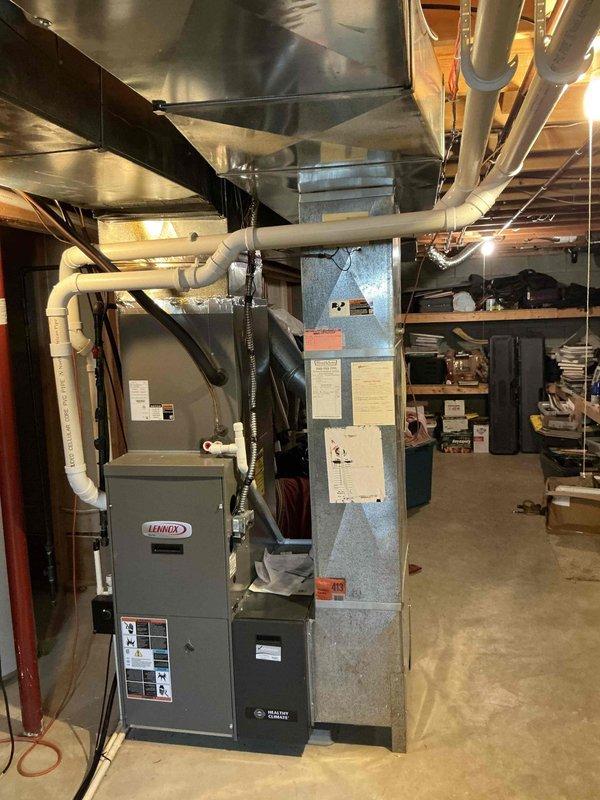 Conducted on-site assessment for furnace replacement estimate in residential basement. Evaluated existing Lennox furnace system, associated ductwork configuration including metallic and PVC components, and current HVAC infrastructure layout. Documented equipment conditions, spatial constraints, and installation requirements through photographic survey to provide accurate replacement system specifications and installation planning.