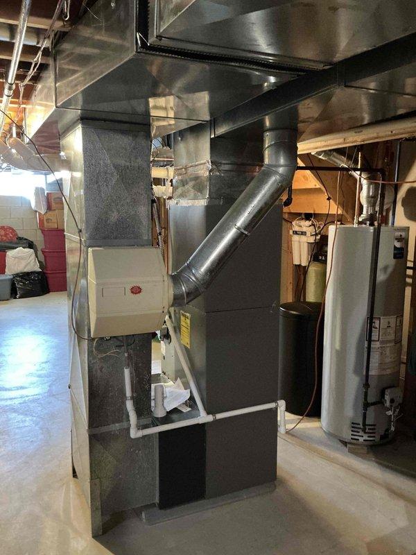 Conducted on-site assessment for furnace replacement estimate in residential basement. Evaluated existing Lennox furnace system, associated ductwork configuration including metallic and PVC components, and current HVAC infrastructure layout. Documented equipment conditions, spatial constraints, and installation requirements through photographic survey to provide accurate replacement system specifications and installation planning.